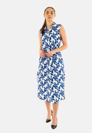 Abito senza maniche con un motivo floreale blu e bianco, design con colletto, lunghezza al ginocchio, vita cintrata e tasche laterali.