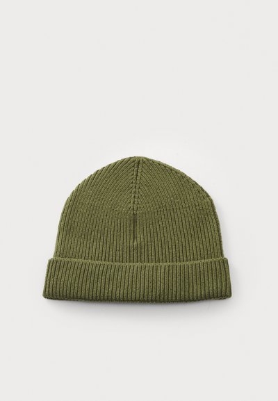 Green ribbed knit beanie with a folded cuff, featuring a textured pattern and a seamless top. Made of soft, stretchy material.