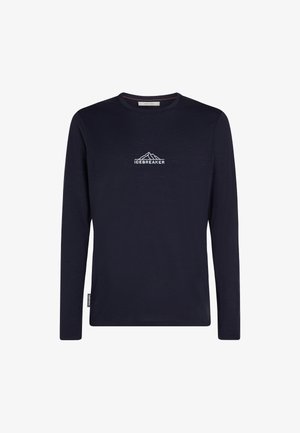 Navy long-sleeve shirt made of soft fabric, featuring a mountain graphic and "ICEBREAKER" text in white on the chest. Smooth texture, crew neck.