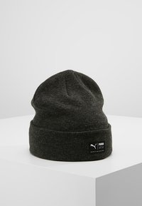 Dark gray beanie hat made of knit material, featuring a folded cuff and a small black brand label on the side. Simple, functional design.