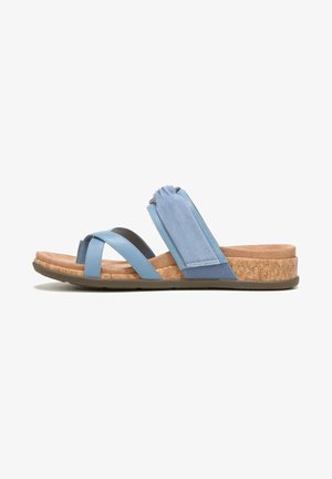 Blue multi-material sandal featuring crisscross straps, soft suede accents, cork midsole, and a tan rubber sole for traction.