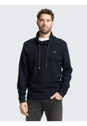 - Bluzka z długim rękawem