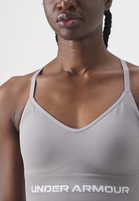 Under Armour VANISH SEAMLESS LOW - Sujetadores deportivos con sujeción ligera - tetra gray/white