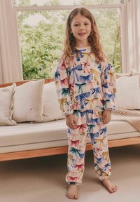 Ensemble de pyjama multicolore avec un motif floral et nœud, fabriqué en tissu doux. Haut à manches longues avec poignets élastiques et pantalons assortis.