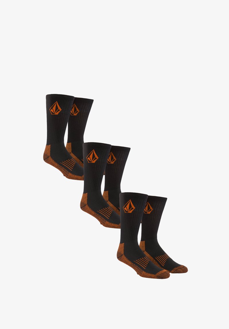 Calze nere con accenti arancioni, texture a coste e logo a forma di diamante. Progettate con tallone e punta rinforzati per una maggiore durabilità.
