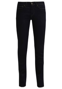 Kapelevat farkut tummassa denimmissä. Ominaisuuksina klassinen viiden taskun malli, vyölenkit ja etupainike, jossa on vetoketju.