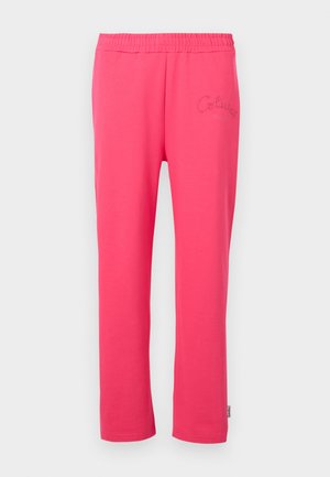 Pantalons de détente en coton rose avec une taille élastique et un détail de logo brodé à l'avant. Présente un design à jambes droites.