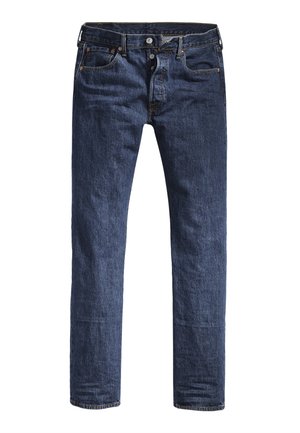 Calças de ganga azul-escura com corte slim, cinco bolsos e uma cintura padrão. Apresenta costuras visíveis e detalhes em metal.