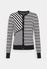 Zwart-wit gestreepte cardigan met lange mouwen, ronde hals en sluitingen met gouden knopen. Bevat strepen van verschillende breedtes en texturen.