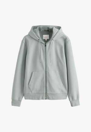 Világosszürke kapucnis pulóver, puha anyagból készült, cipzáros záródással, elülső zsebekkel és húzózsinóros kapucnival. Sima tapintású, bordázott mandzsettákkal.