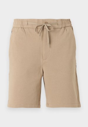 Shorts décontractés pour hommes de couleur beige avec taille élastique, cordon de serrage, poche latérale à fermeture éclair, et coupe ample allant au-dessus du genou.
