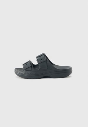 Sandalo nero senza lacci con due cinturini regolabili con fibbia e soletta testurizzata, progettato per comfort casual e facilità di utilizzo.