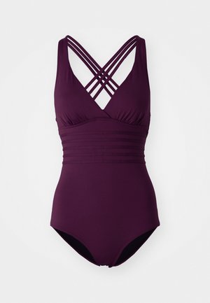 Plum-värinen yksiosainen uimapuku, jossa on ristikkäiset hihnat ja laskostettu kangas rinnassa. Uimapuvussa on sileä, venyvä rakenne ja korkealle leikattu lahje.