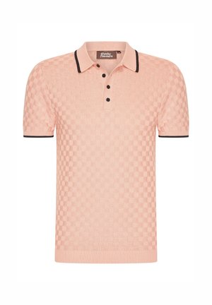 Light pink polo shirt with a textured checkered pattern, black collar, and three-button placket. Ribbed sleeves and hem.