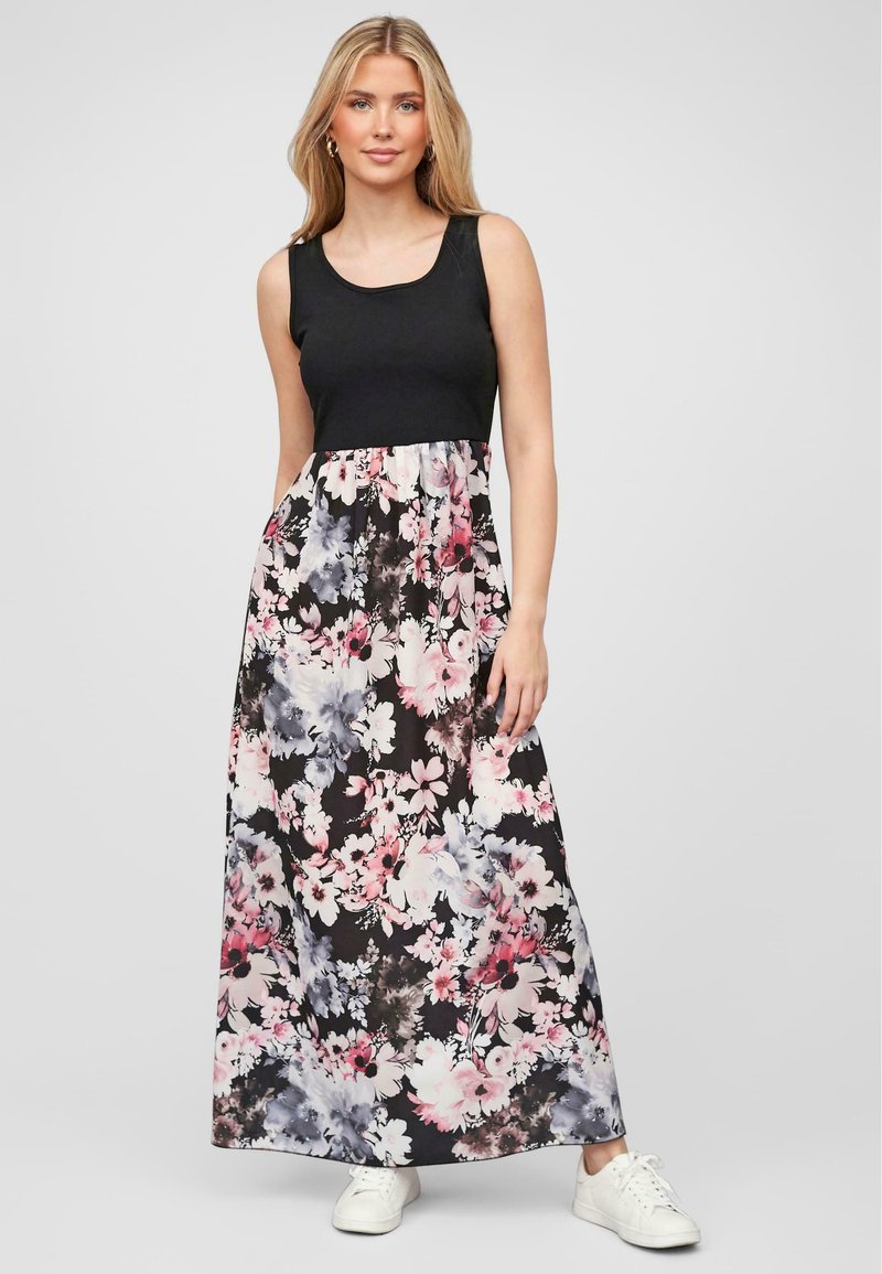Robe maxi florale avec un haut sans manches noir et un motif floral multicolore dans des nuances de rose et de bleu sur un fond noir.