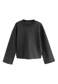 Schwarzes, kurzes Sweatshirt aus weichem Stoff. Es verfügt über einen Rundhalsausschnitt, überschnittene Schultern und elastische Bündchen mit nahtloser Verarbeitung.