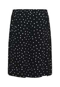 Jupe noire à pois blancs avec taille élastique, longueur genou et légèrement évasée.
