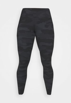 Melnas legingi ar kamuflāžas rakstu, ar augstu jostas vietu un gludu faktūru. Izgatavoti no elastīga materiāla komfortam un elastībai.
