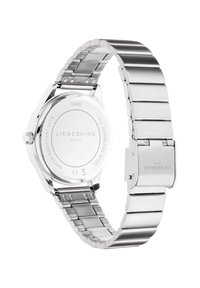 Edelstahl-Uhr mit einem silbernen Metallarmband, rundem Gehäuse und polierter Oberfläche. Auf der Rückseite sind der eingravierte Markenname und Angaben zur Wasserbeständigkeit zu finden.