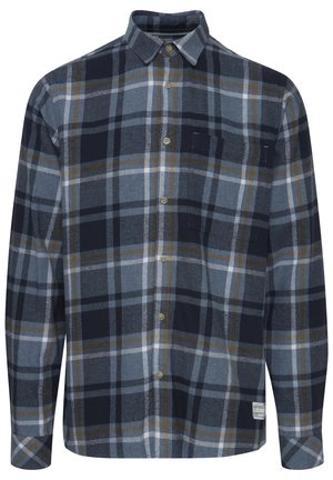 Flanellskjorte i marineblå, blå og grå rutemønster. Har knappestolpe foran, lange ermer og to brystlommer. Myk tekstur og avslappet passform.