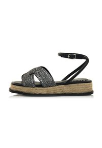 Sandali neri con cinturini, superiore intrecciato e testurizzato, piattaforma in juta avvolta in stile espadrillas, cinturino alla caviglia regolabile e suola in gomma.