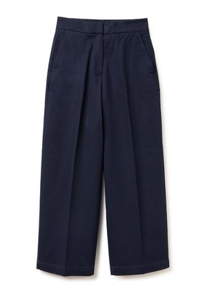 Pantalon bleu marine taille haute à jambes larges avec poches latérales et fermeture frontale dissimulée sur fond blanc.