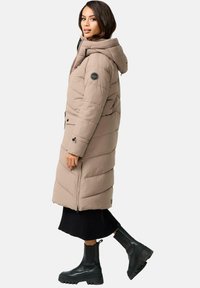 Beige puffer coat with a hood, featuring horizontal quilted design, zippered front, side pockets, and a logo patch on the sleeve.