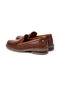 Brown leather loafers with a smooth finish, rounded toe, stitched detailing, and a low stacked heel. Side has a small decorative emblem.