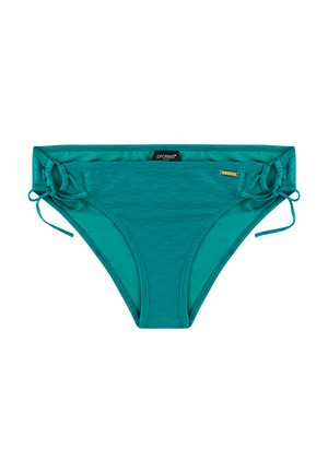 Sinivihreät bikinihousut, jotka on valmistettu teksturoidusta kankaasta. Niissä on solmimisnauhat kummallakin puolella ja pieni brändätty lippu etukappaleen vyötärönauhassa.