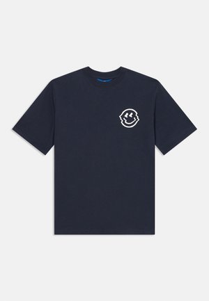 Navy blue short-sleeve T-shirt with a small white abstract smiling face graphic on the left chest against a white background.
