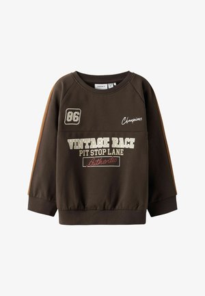Brown sweatshirt with raglan sleeves, featuring a ribbed neckline and cuffs. Printed text and logos in white and red on the front.