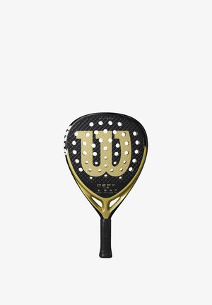 Schwarzer und goldener Paddel mit Honigwabenstruktur, ausgestattet mit einem großen "W"-Logo. Der Griff ist schwarz und hat eine geriffelte Oberfläche für einfaches Handling.