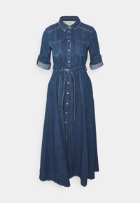 Long denim shirt dress with rolled-up sleeves, button-down front, chest pockets, and a tied waist belt.