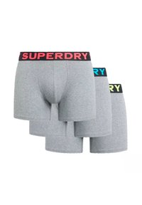 Bóxer para hombre en gris con una cintura elástica negra que presenta "SUPERDRY" en texto rosa, azul y verde. Tela suave, diseño ajustado.