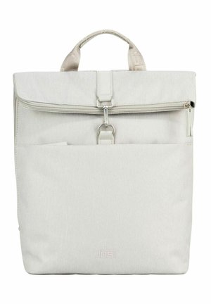 Light beige fabric backpack with a top handle, front zip pocket, and metal clasp closure centered below the zipper.