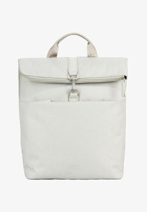 Light beige fabric backpack with a top handle, front zip pocket, and metal clasp closure centered below the zipper.