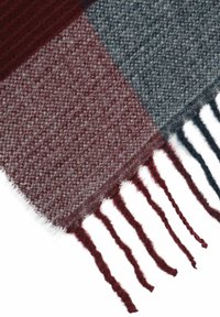 Red, gray, and blue checkered wool scarf with fringed edges, featuring a soft texture and interwoven patterns.