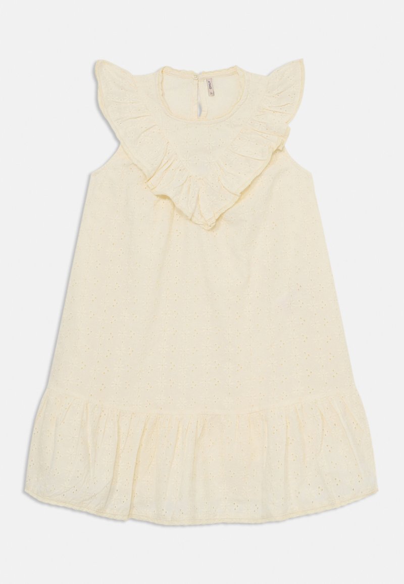 Dzeltena kokvilnas kleita ar viļņotu kakla izgriezumu, ziedu acu rakstu un plašu apakšmalu. Aprīkota ar aizmugurējo rāvējslēdzēja aizdari.