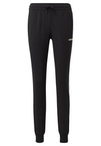 Svarta sweatpants med elastiskt midjeband och dragsko. Har avsmalnande ben, ribbade muddar och en liten vit logotyp på vänster sida.