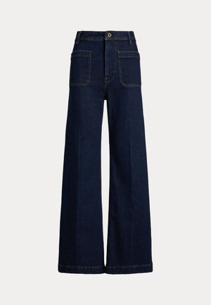 Vida jeans i mörkblå denim med hög midja, två framfickor och två bakfickor med knäppning.
