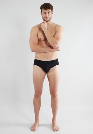 Zwarte herenboxershorts van gladde stof met een lage taille, voorzien van een discrete band en zonder zichtbare patronen of hardware.