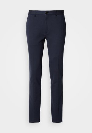 Navy trousers made from a smooth, stretch fabric. Features a zip fly, a single button closure, and slim, tapered legs.