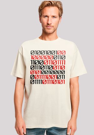 Beige cotton t-shirt with short sleeves, featuring a geometric binary code design in black, red, and gray across the front.