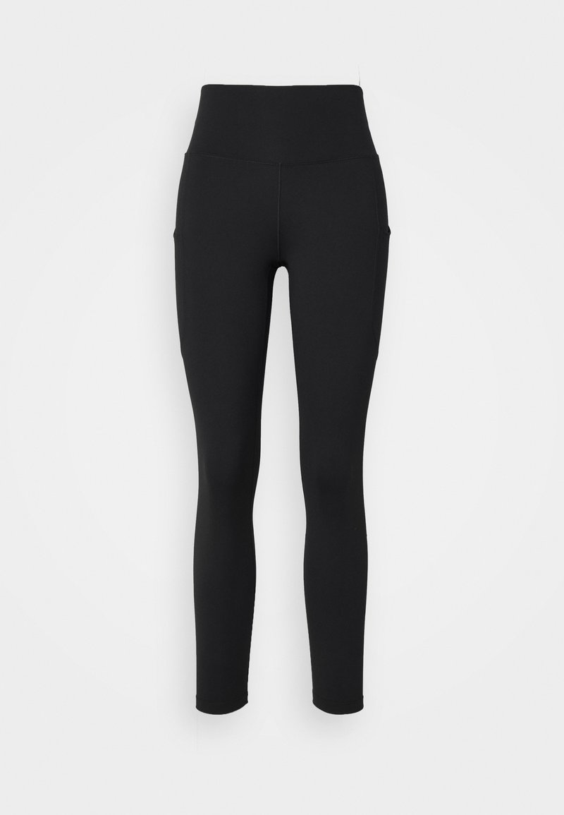 Leggings neri con vita alta, realizzati in tessuto elasticizzato, dotati di tasche laterali e una finitura liscia al tatto.
