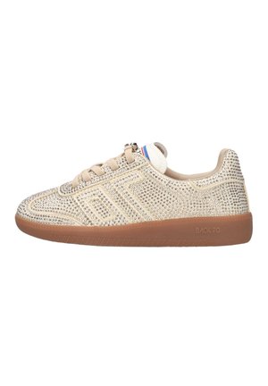 Beige low-top sneaker with gum sole, beige laces, and upper adorned with silver studs arranged in geometric patterns.
