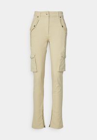 Beige cargo pants made of lightweight fabric, featuring side pockets, front button, and zippers at the ankles for adjustable fit.