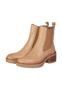 Stivaletti in pelle tan con pannelli elastici ai lati, tacco a blocco e dettagli rigati lungo la suola e il tacco. Design con punta rotonda.