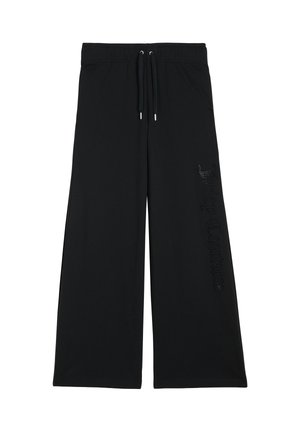 Schwarze, weit geschnittene Sweatpants mit elastischem Bund, Kordelzug und dem „Juicy Couture“-Logo in glänzenden Details auf dem linken Bein. Weicher Stoff.