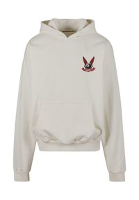 Hanorac crem cu buzunar frontal tip kangaroo, manșete ribbed, croială relaxată și un logo roșu brodat cu aripi pe piept.