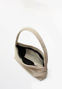 Beige suede shoulder bag with a single strap, open zipper, and visible interior pocket on a white background.